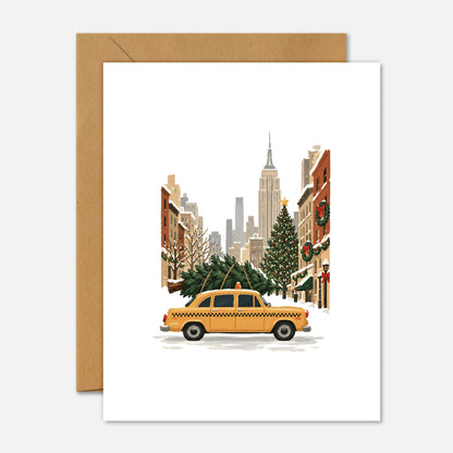 New York City Christmas greeting card featuring a yellow NYC taxi decorated for the holidays on a white background.