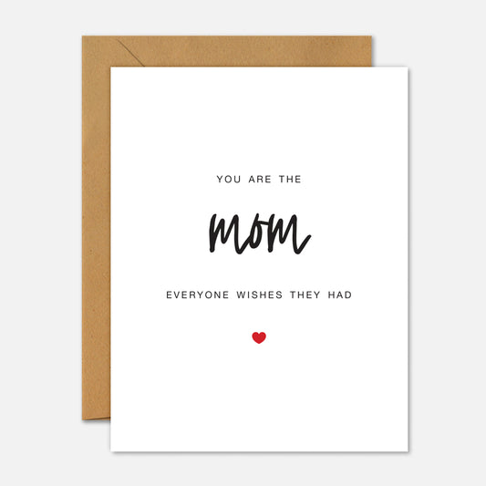 Greeting card with text 'You are the mom everyone wishes they had' on a white background with a brown envelope.