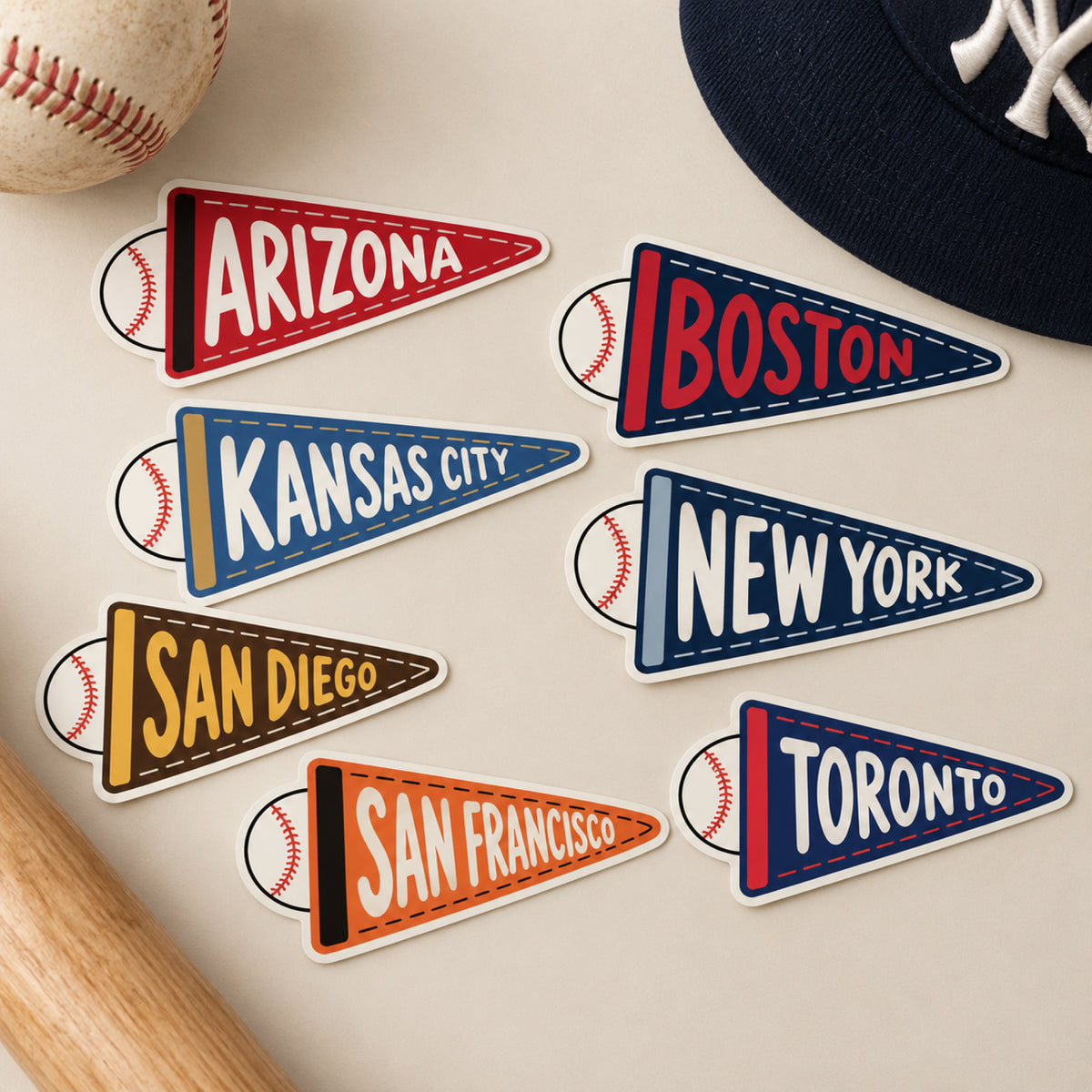 Baseball-themed vinyl stickers arranged on a light beige surface with baseball props.