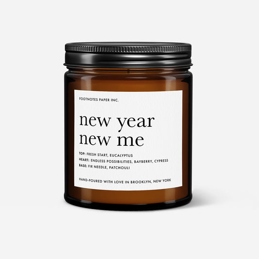 amber jar New Year New Me candle with blank white label on black and gold confetti background