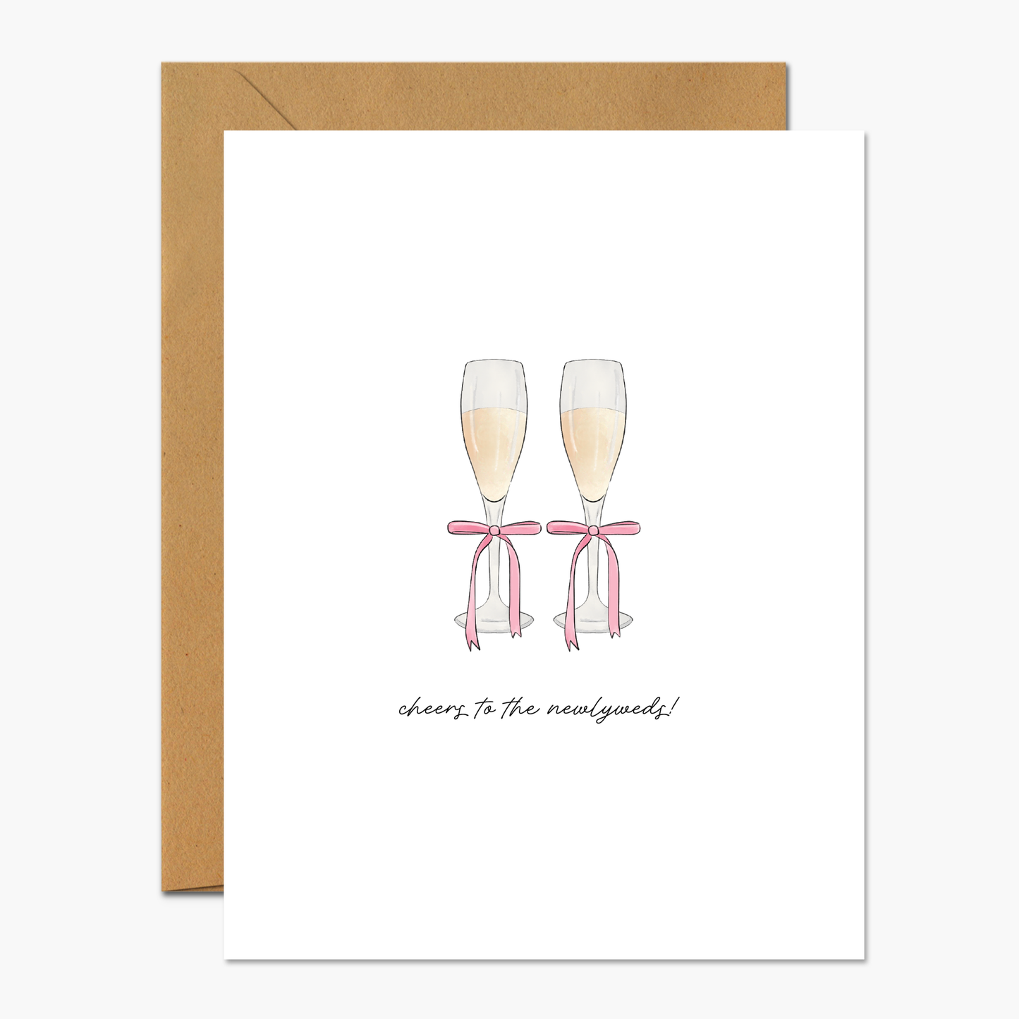 Greeting card with a soft pink champagne glasses design and "Cheers To The Newlyweds," perfect for same-sex wedding celebrations.