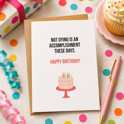 Funny birthday card displayed with a birthday cake, candles, confetti, and wrapped gifts for a sarcastic birthday celebration.