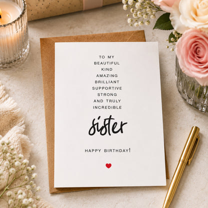 To My Sister birthday card featuring heartfelt typography with the words beautiful, kind, amazing, brilliant, supportive, strong, and incredible on a minimalist white greeting card with a kraft envelope.