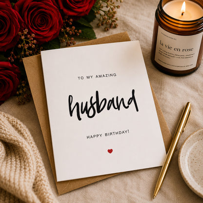 To My Husband birthday card with minimalist black typography and a small red heart on a white A2 card with kraft envelope.