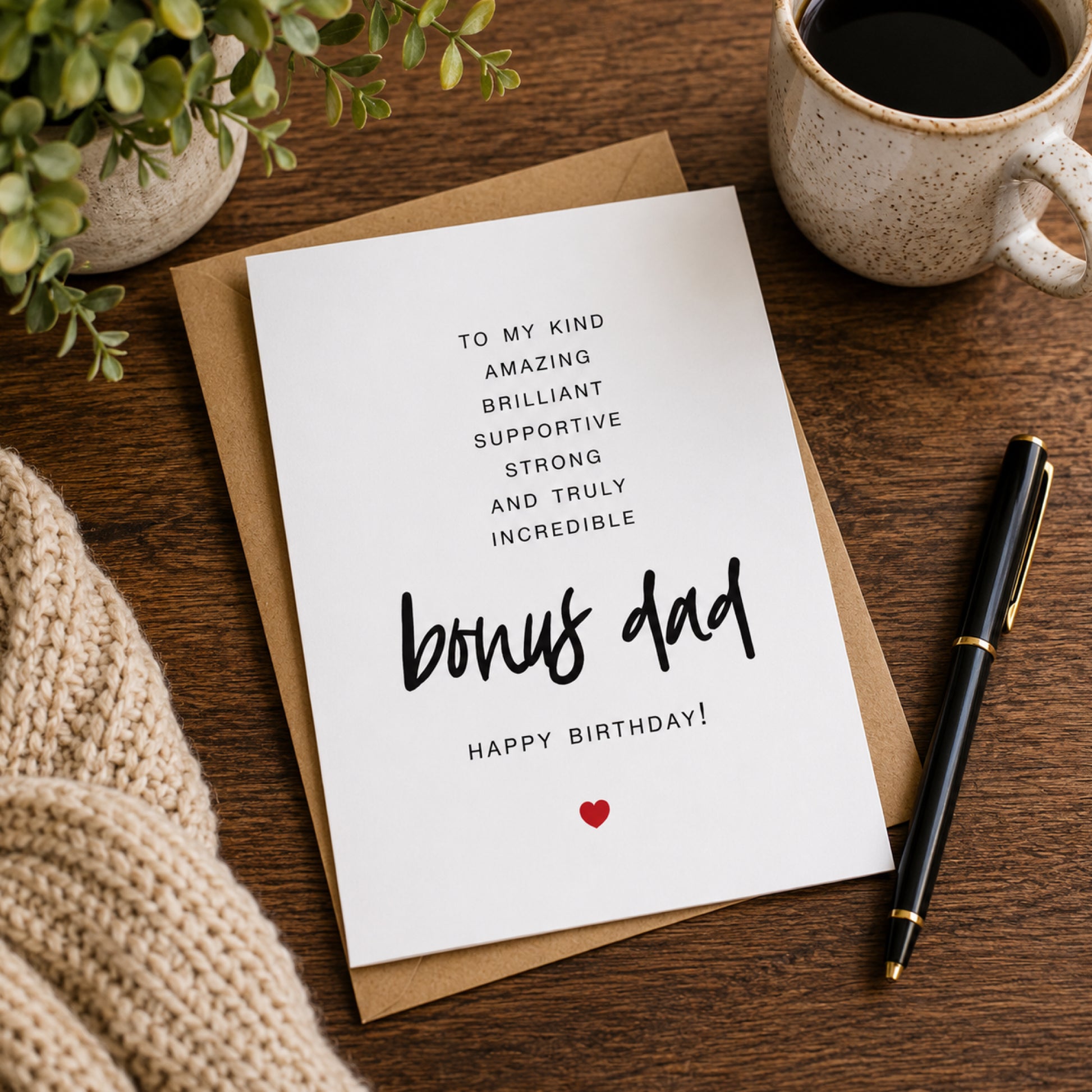 To My Bonus Dad birthday card with minimalist black typography and a small red heart on a white A2 card with kraft envelope.