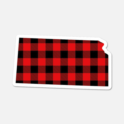 Red and black plaid patterned state of Kansas shape on a white background