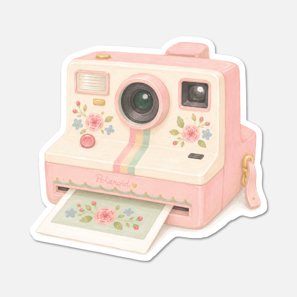 Pink Polaroid camera with floral design on a white background