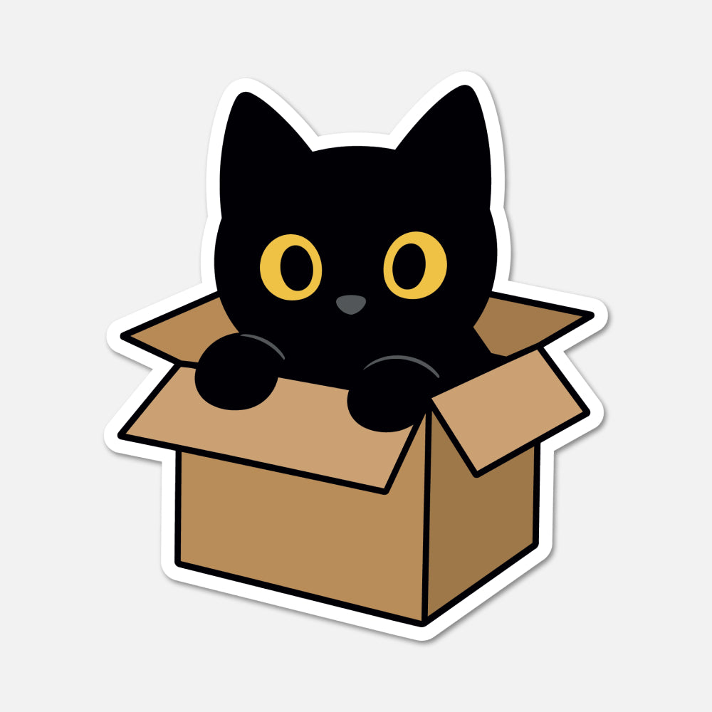A die-cut sticker featuring a cute cartoon black cat with yellow eyes popping out of a brown cardboard box, shown on a light gray background.
