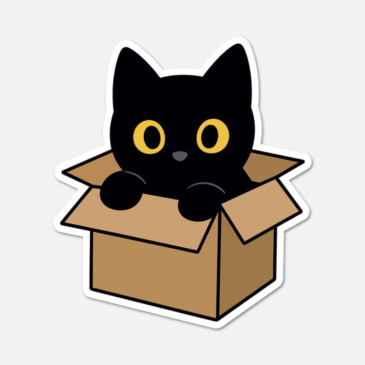 A die-cut sticker featuring a cute cartoon black cat with yellow eyes popping out of a brown cardboard box, shown on a light gray background.
