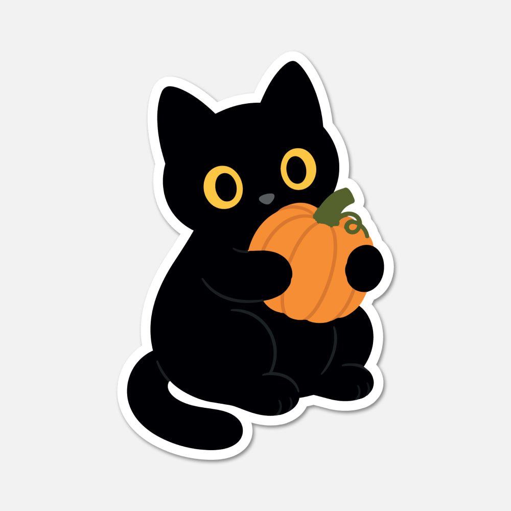 A die-cut sticker featuring a cute black cat holding an orange pumpkin, shown on a light gray background.