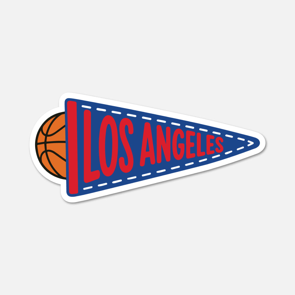 A die-cut sticker of a Los Angeles basketball-themed pennant, featuring a blue pennant with red lettering and a partial basketball peeking out from behind on the left, set against a light gray background.