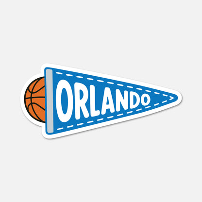 A die-cut sticker featuring a blue basketball-themed pennant with the word 'ORLANDO' in white, plus a partial orange basketball visible on the left, shown on a light gray background.