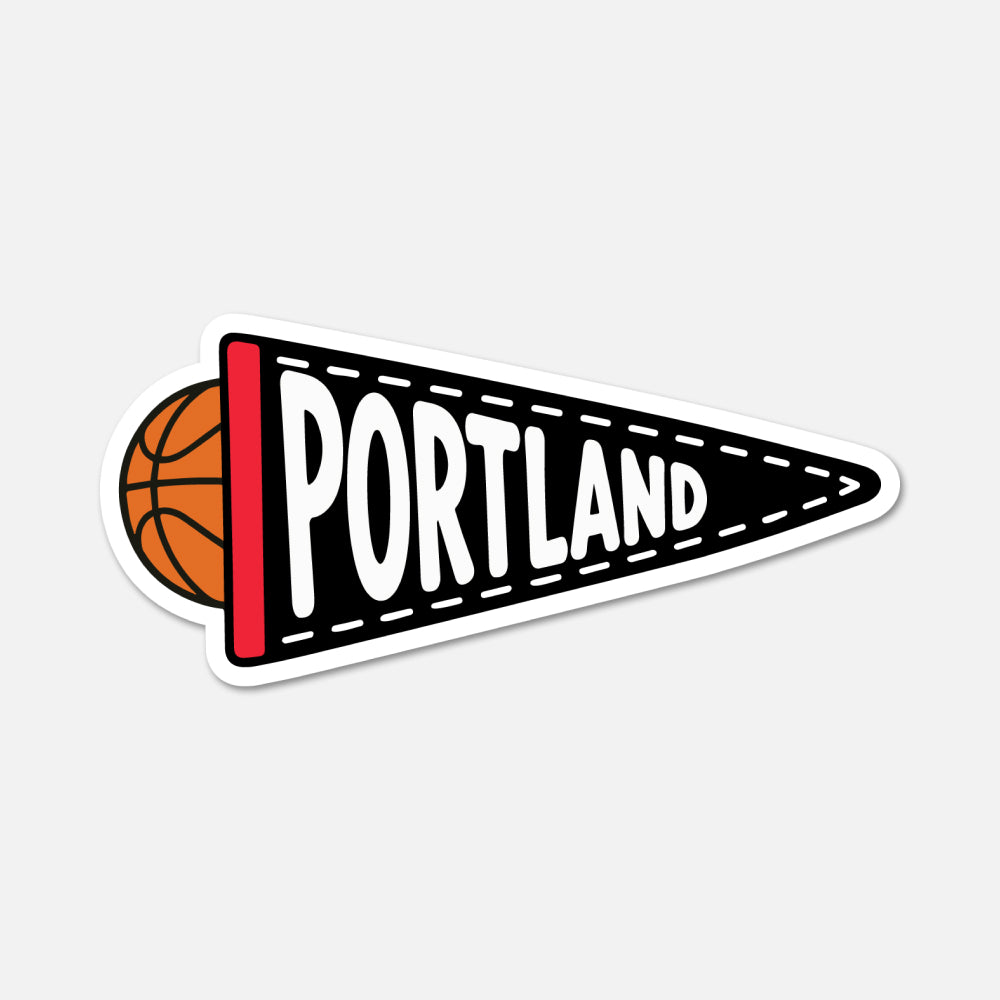 A die-cut sticker of a black sports pennant with the word 'PORTLAND' in white, a red stripe on the left, and an orange basketball partially visible behind it, shown on a light gray background.