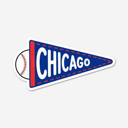 A die-cut sticker shaped like a blue and red Chicago baseball pennant, with a baseball graphic peeking out from behind the left side and the word CHICAGO in white across the front, shown on a light gray background.