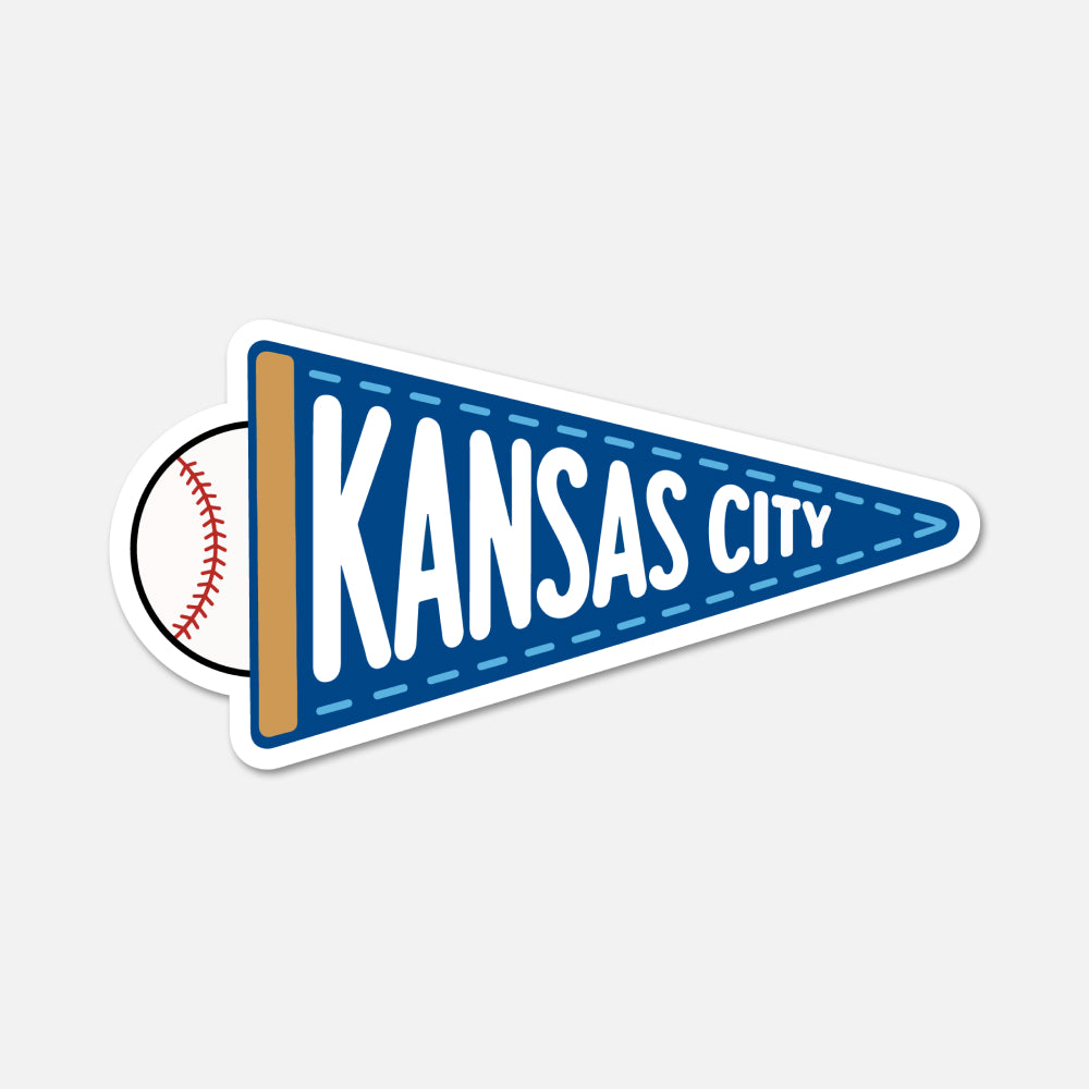 A die-cut sticker shaped like a blue football-style pennant with white text reading 'KANSAS CITY' and a baseball peeking out from behind on the left, shown on a light gray background.