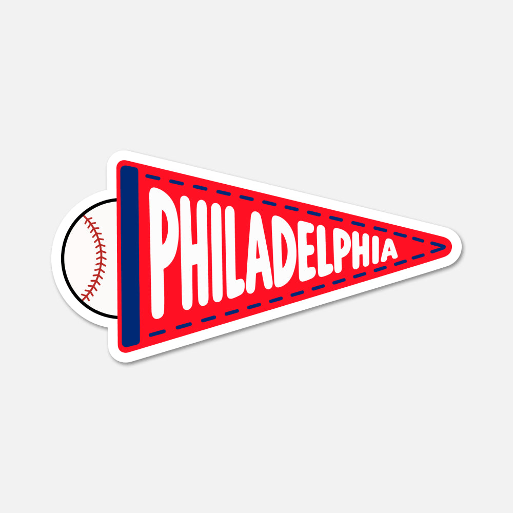 A die-cut sticker shaped like a red Philadelphia pennant with a baseball peeking out from behind it, shown on a light gray background.