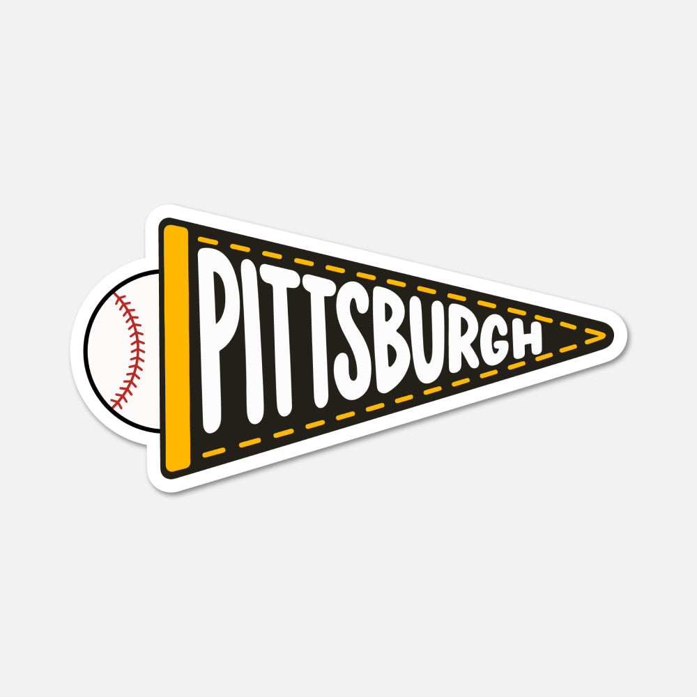 A die-cut sticker shaped like a black and yellow Pittsburgh pennant, with a baseball partially visible behind it on the left. The word 'PITTSBURGH' is printed across the pennant in large white letters with a black outline.