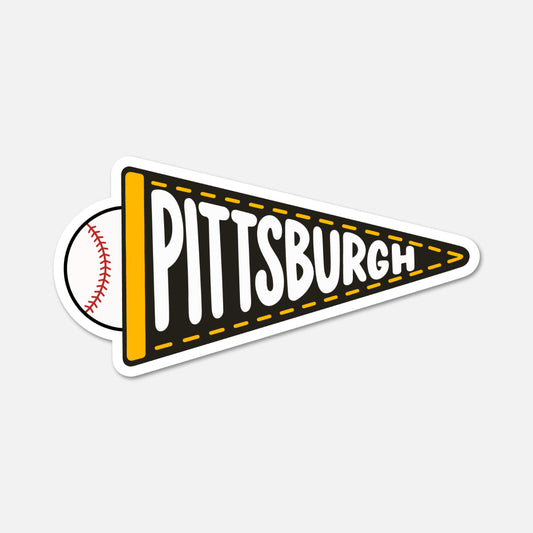 A die-cut sticker shaped like a black and yellow Pittsburgh pennant, with a baseball partially visible behind it on the left. The word 'PITTSBURGH' is printed across the pennant in large white letters with a black outline.
