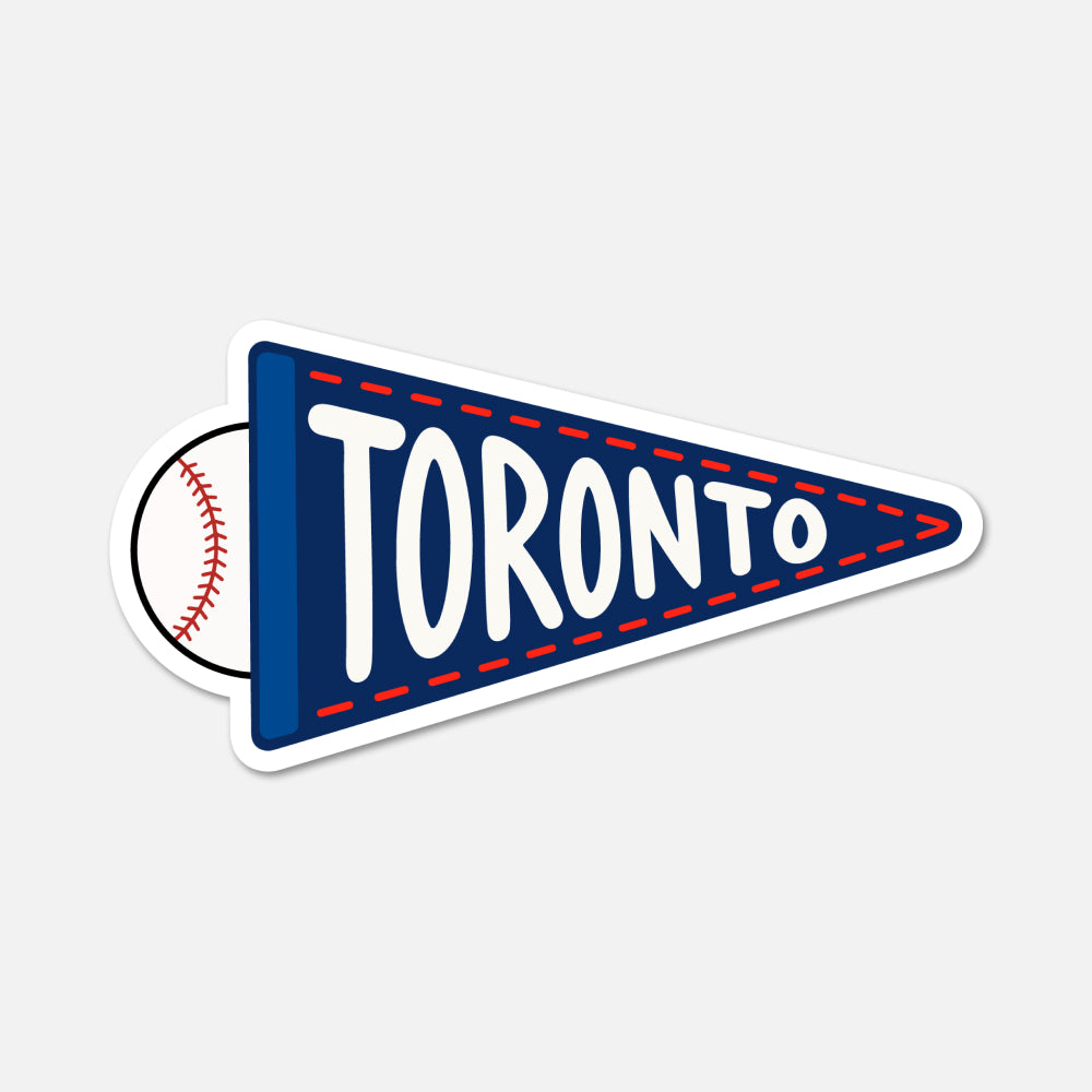 A die-cut sticker shaped like a navy blue sports pennant with the word TORONTO in large white letters and a baseball partially visible behind it, shown on a light gray background.