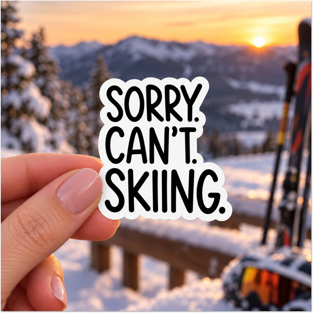 A hand holds a die-cut sticker that reads 'SORRY. CAN'T. SKIING.'
