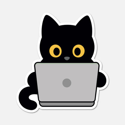 A die-cut sticker featuring a cartoon black cat with large yellow eyes using a gray laptop, shown on a light gray background.