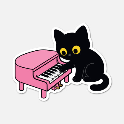 A die-cut sticker featuring a cartoon black cat with large yellow eyes playing a pink grand piano, shown on a light gray background.