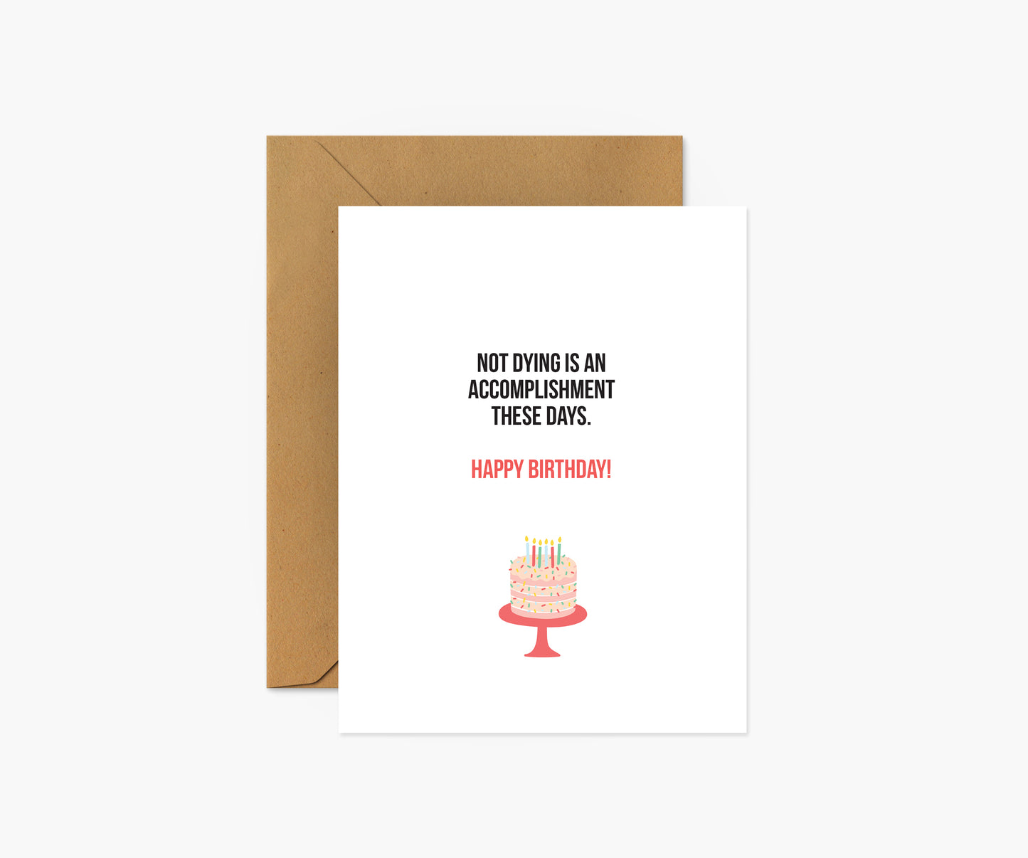 Not dying is an accomplishment Birthday Card | Footnotes Paper