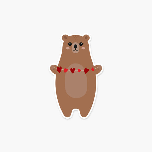 Bear holding a string of hearts Valentine's Day Sticker | Footnotes Paper