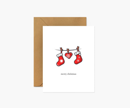 Stockings hanging from string Christmas Greeting Card - Footnotes Paper