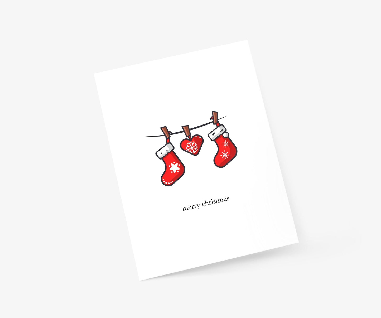 Stockings hanging from string Christmas Greeting Card - Footnotes Paper